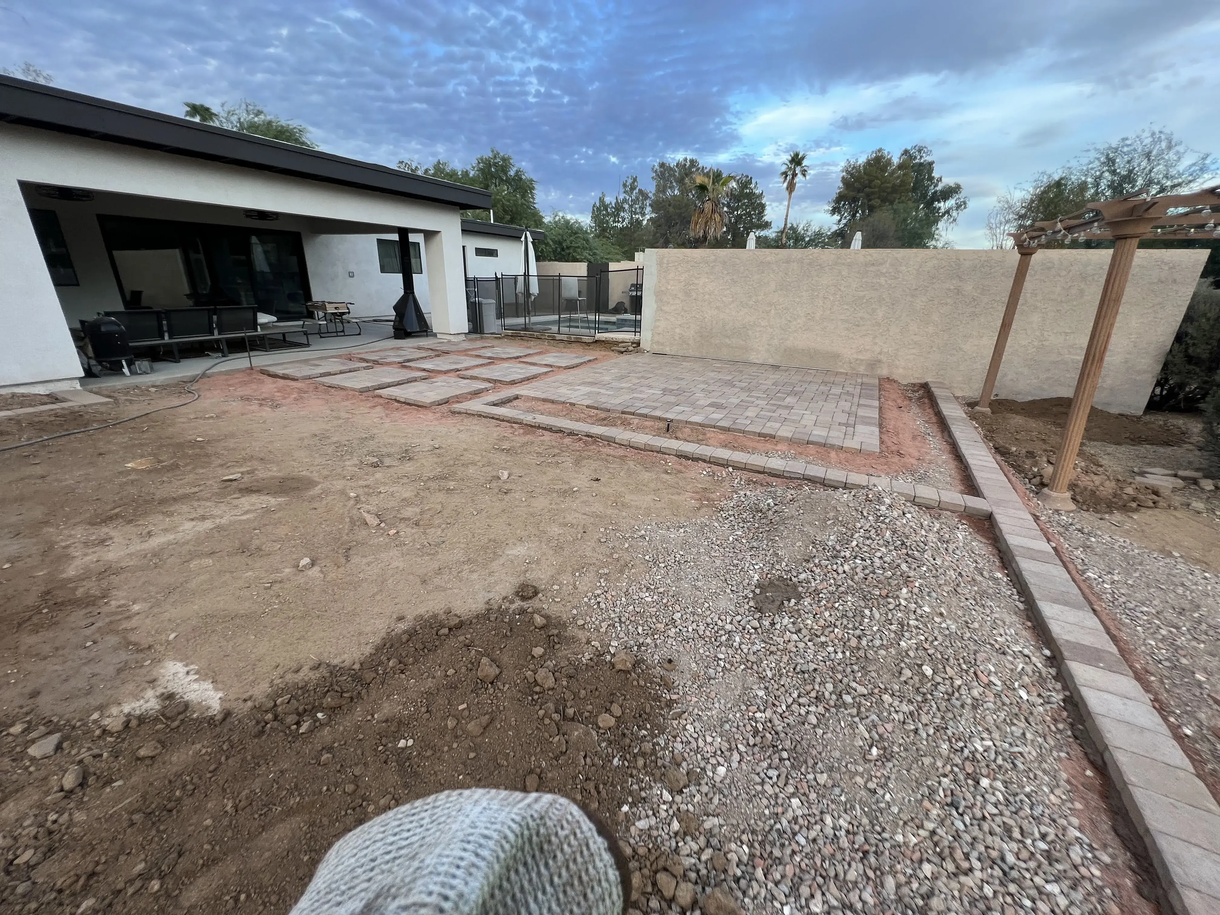 Before: Backyard transformation with artificial grass and extended paver patio