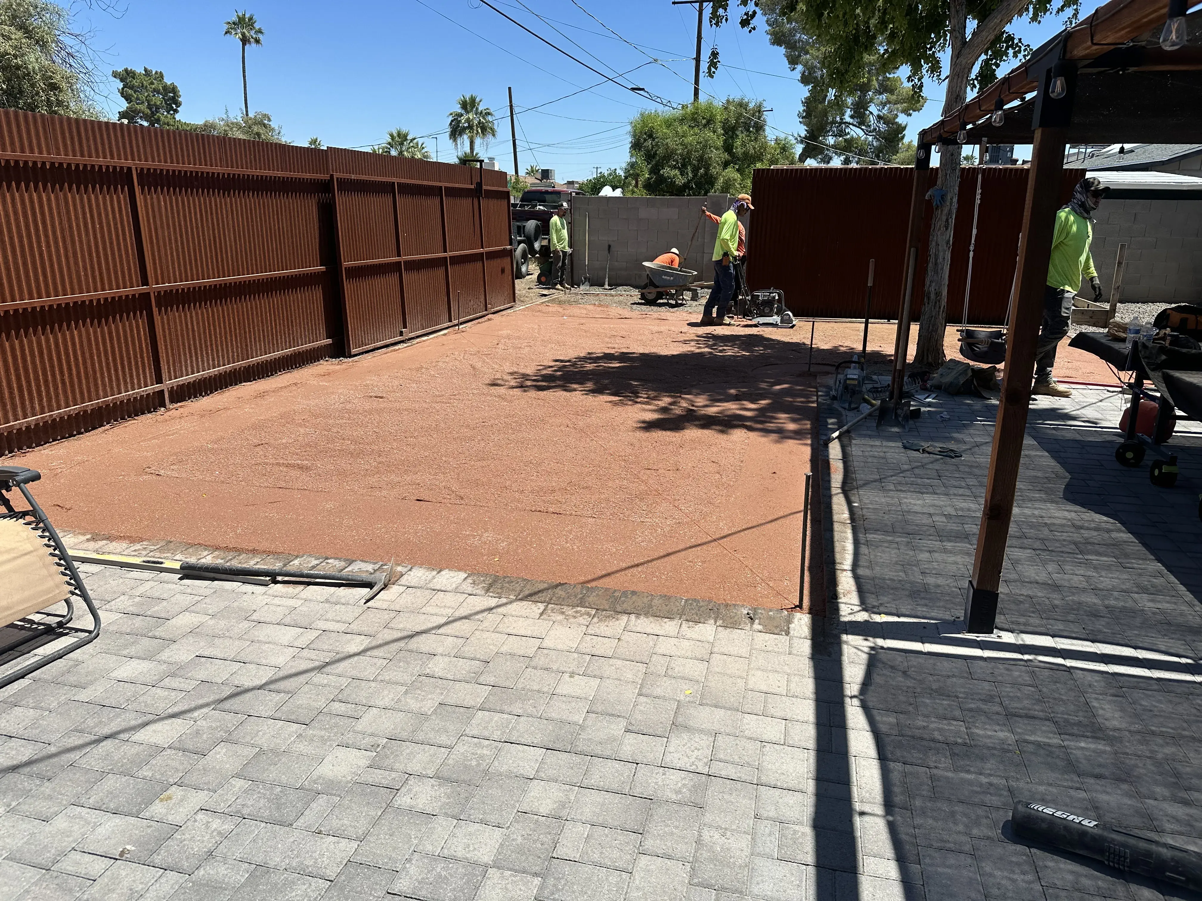 Before: Backyard transformation with artificial grass and extended paver patio