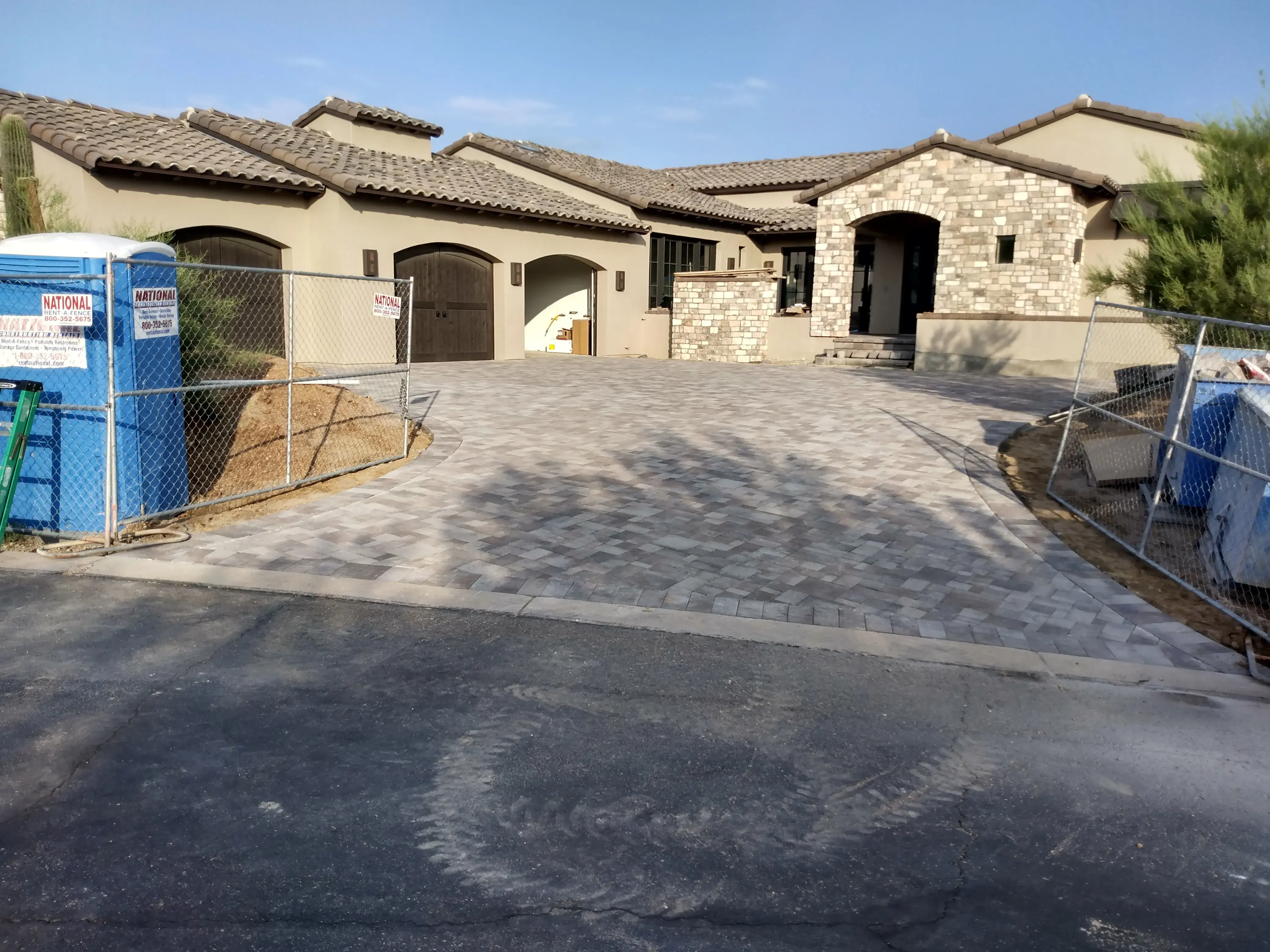 After: Backyard transformation with artificial grass and extended paver patio