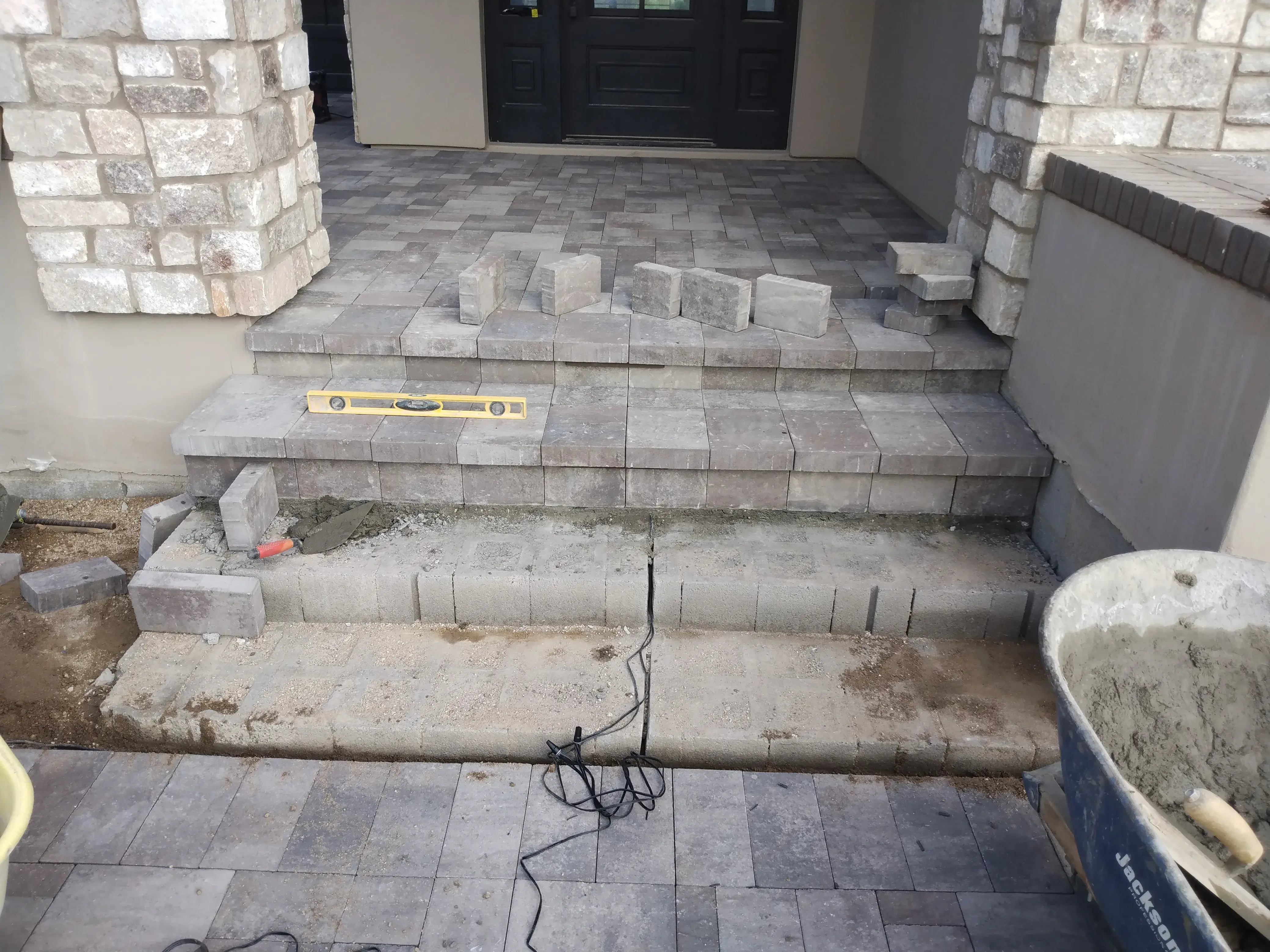 Before: Backyard transformation with artificial grass and extended paver patio