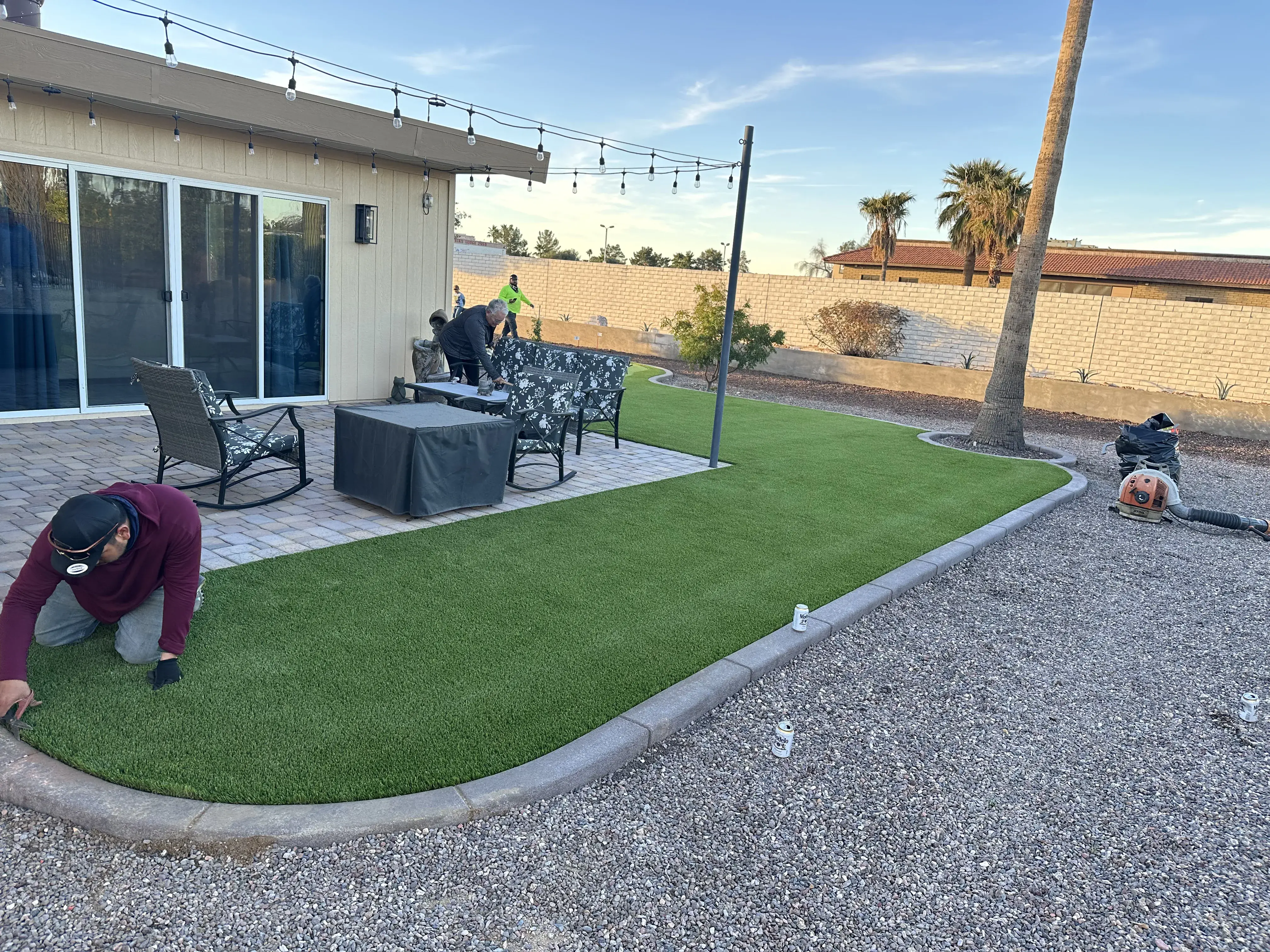 After: Backyard putting green installation with artificial grass and sand traps